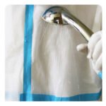 Disposable coverall with tape
